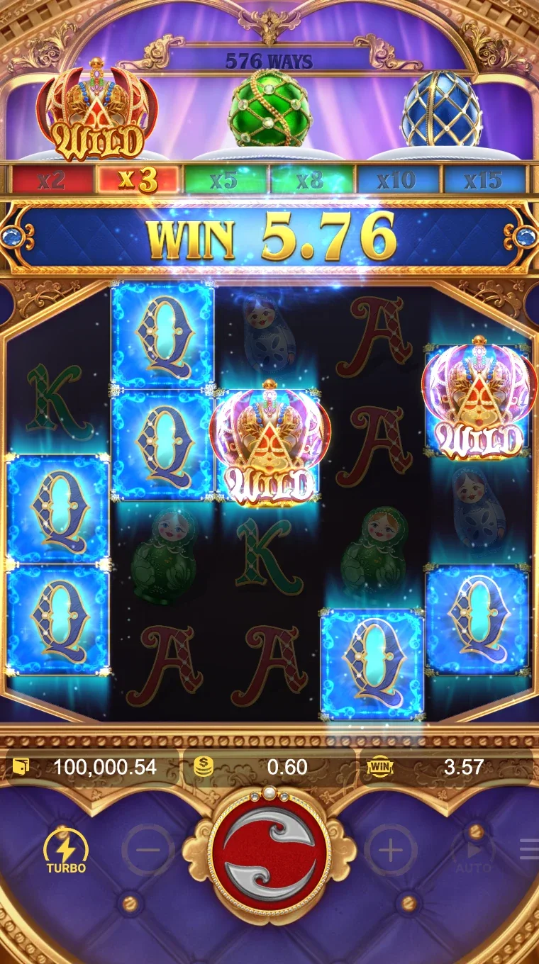 Cascade win of 5.76 at x3 multiplier shows Wild crowns and glowing blue Q symbols mid-explosion
